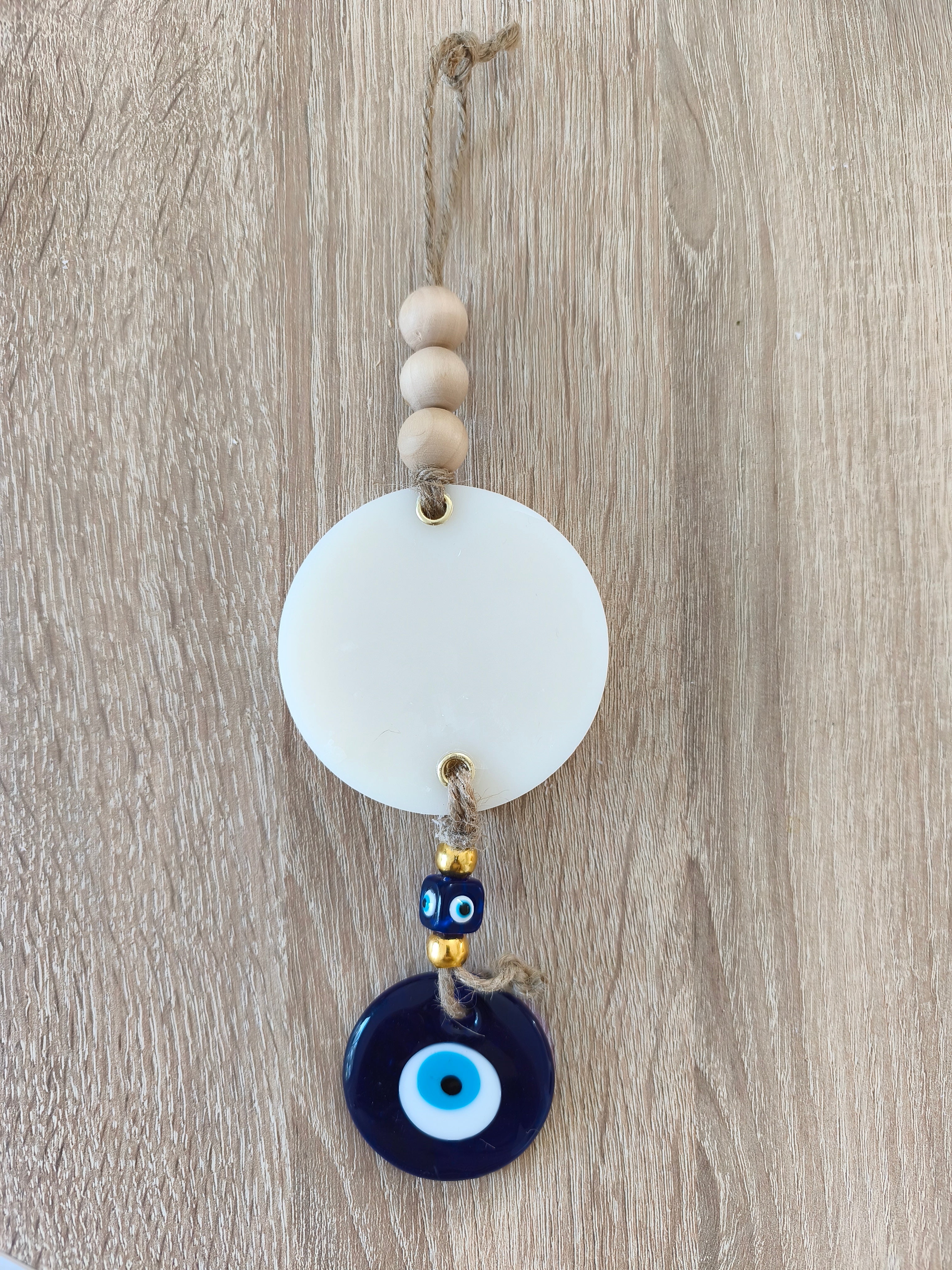 Suspension décorative avec rond de cire parfumée et œil turc