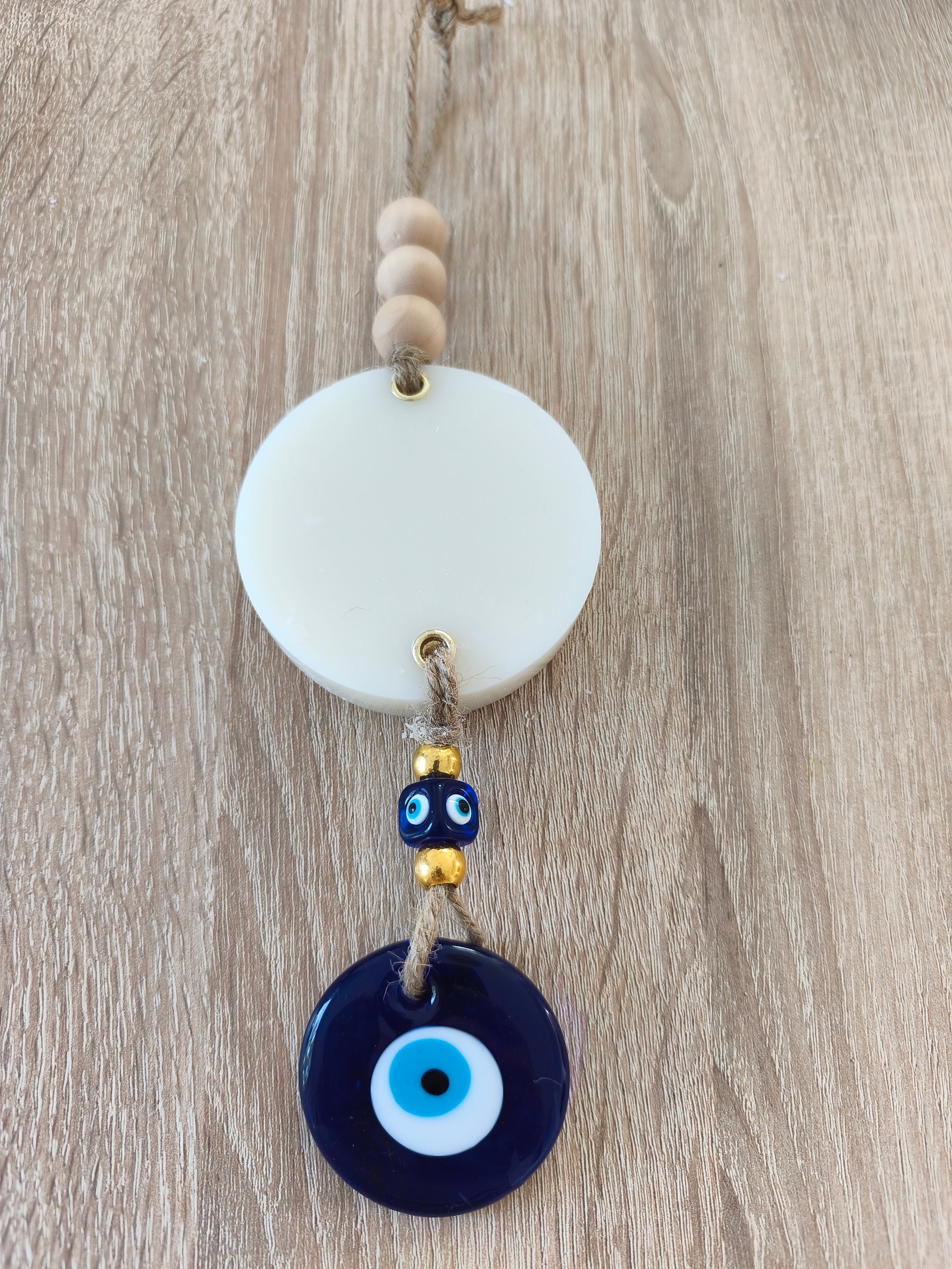 Suspension décorative avec rond de cire parfumée et œil turc